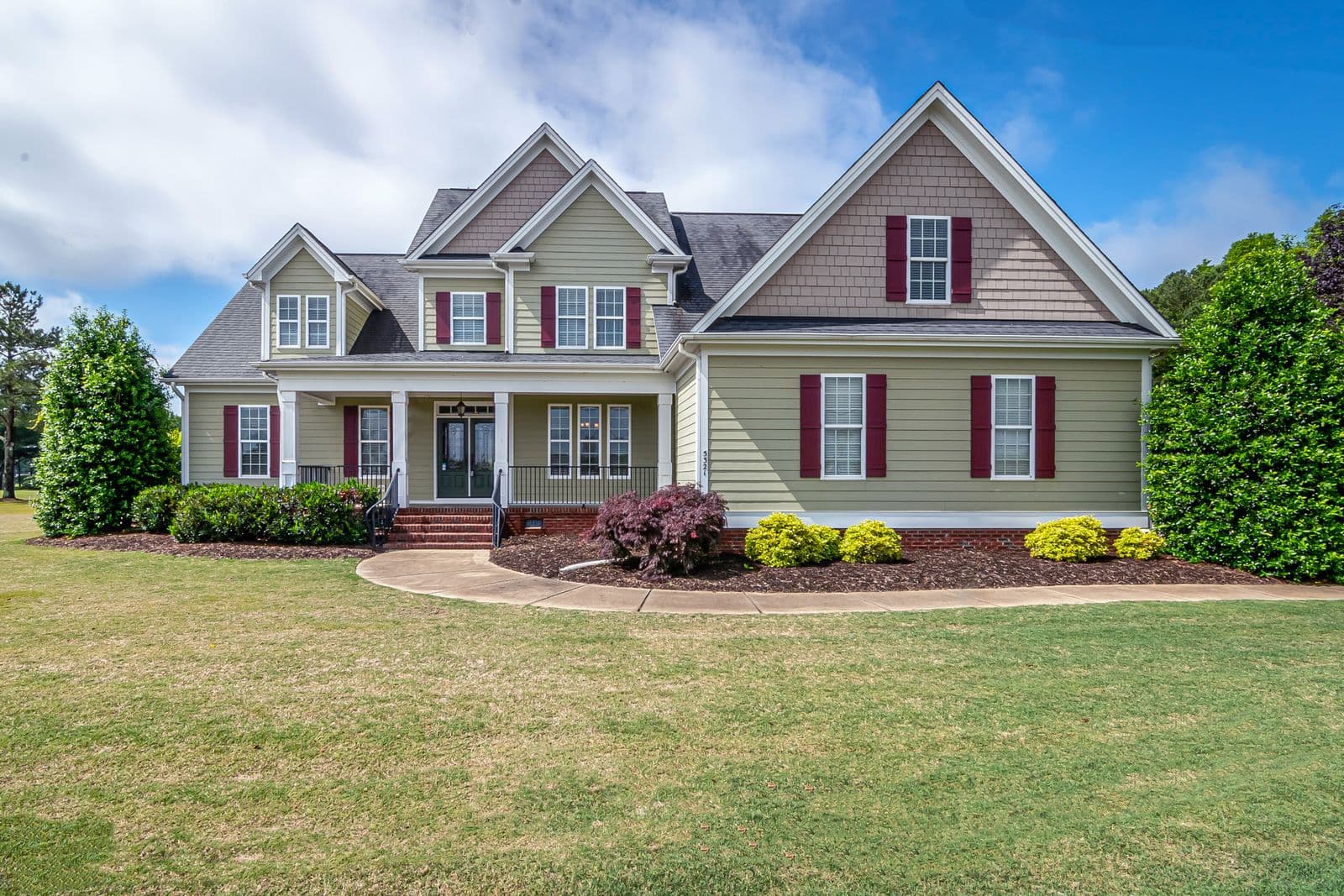 A suburban single-family home with a landscaped front yard